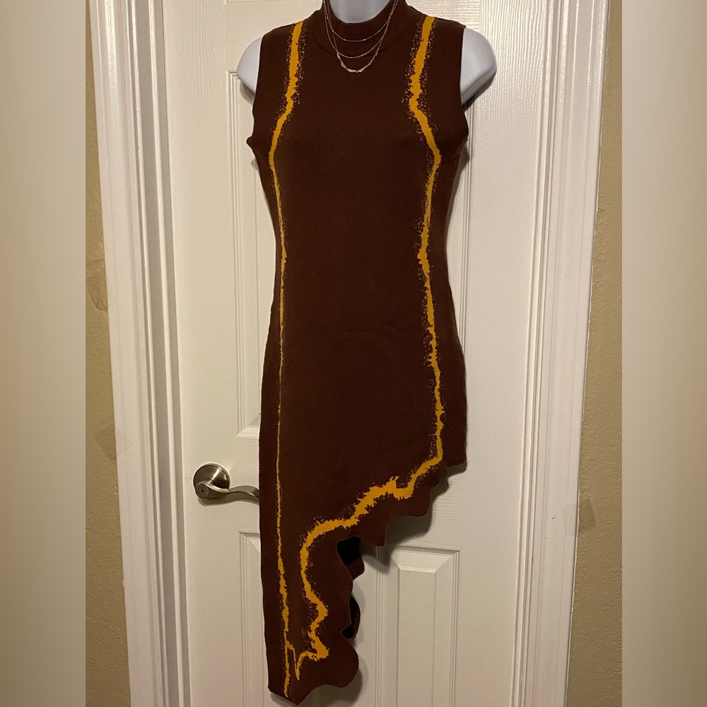 Brown sleeveless dress,half leg, gold strip down on both sides of the dress.